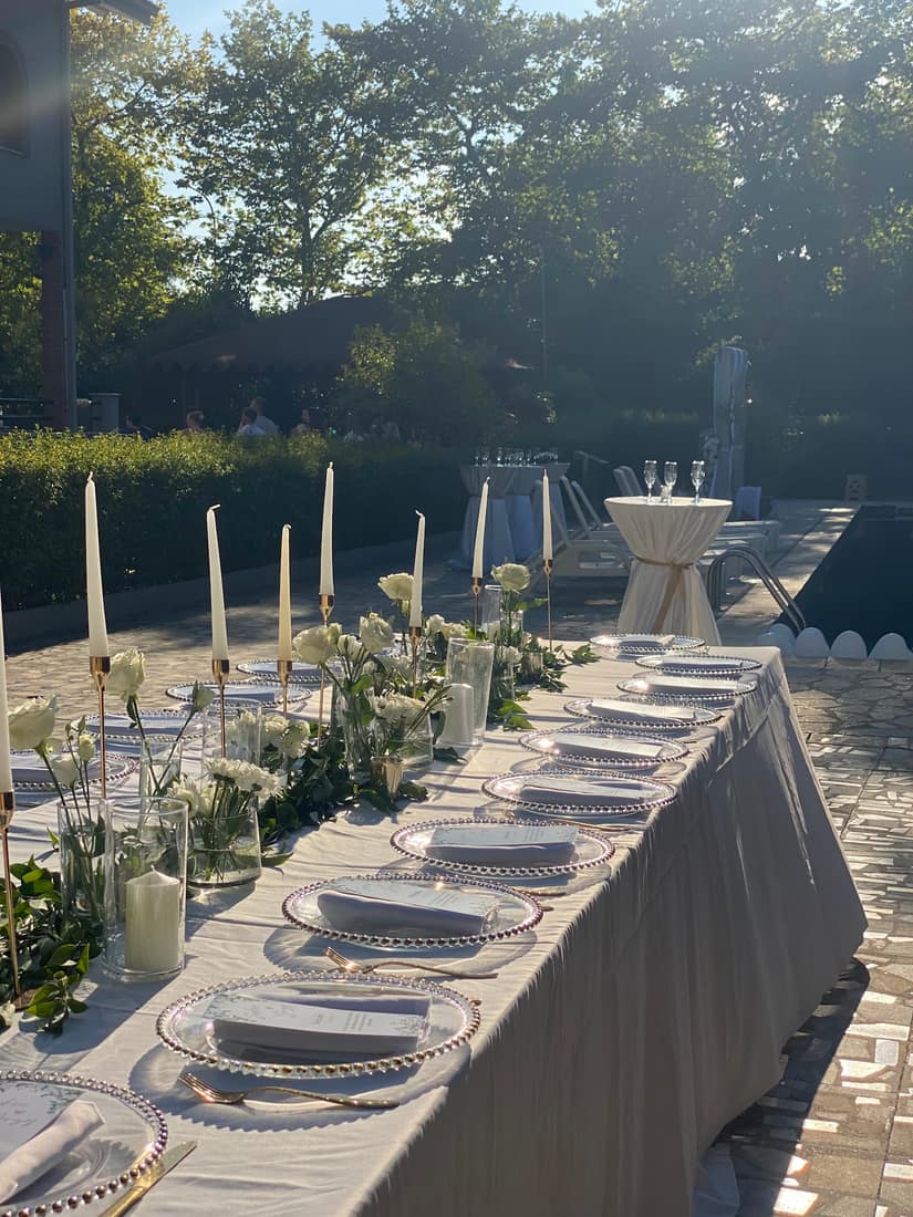 Evening table with tall candles and white flowers